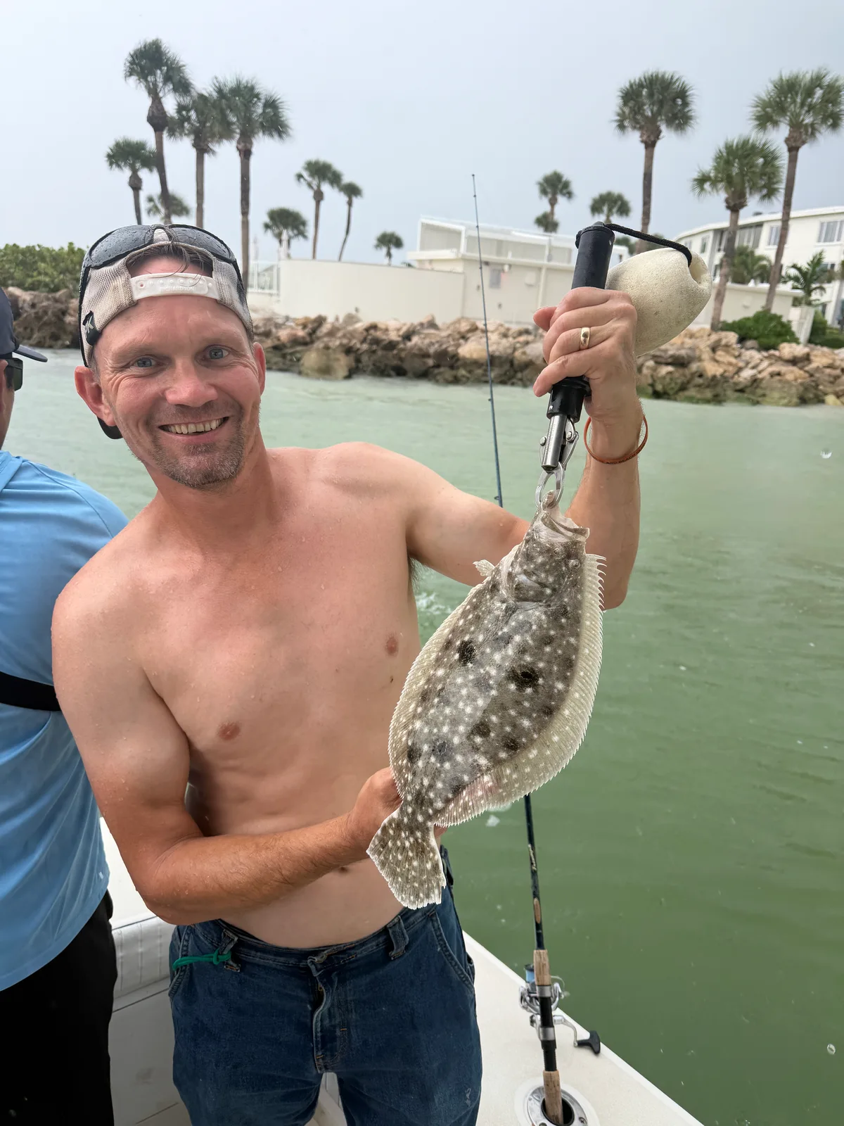 Angler displays a flounder aboard a Sarasota fishing trip — October 9, 2026.