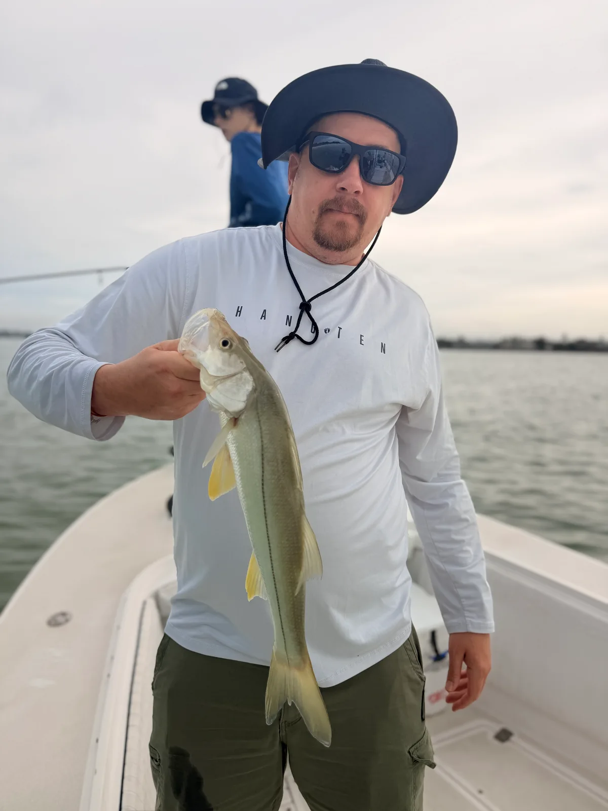 Angler displays a snook on a Sarasota fishing trip — October 9, 2026.